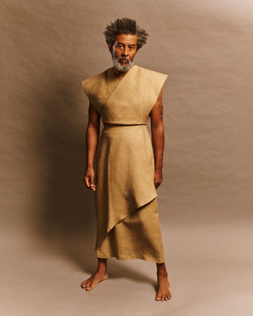 Men and women asymmetrical wrap skirt in beige linen deadstock fabric with mother-of-pearl buttons model Odette LES DUNES